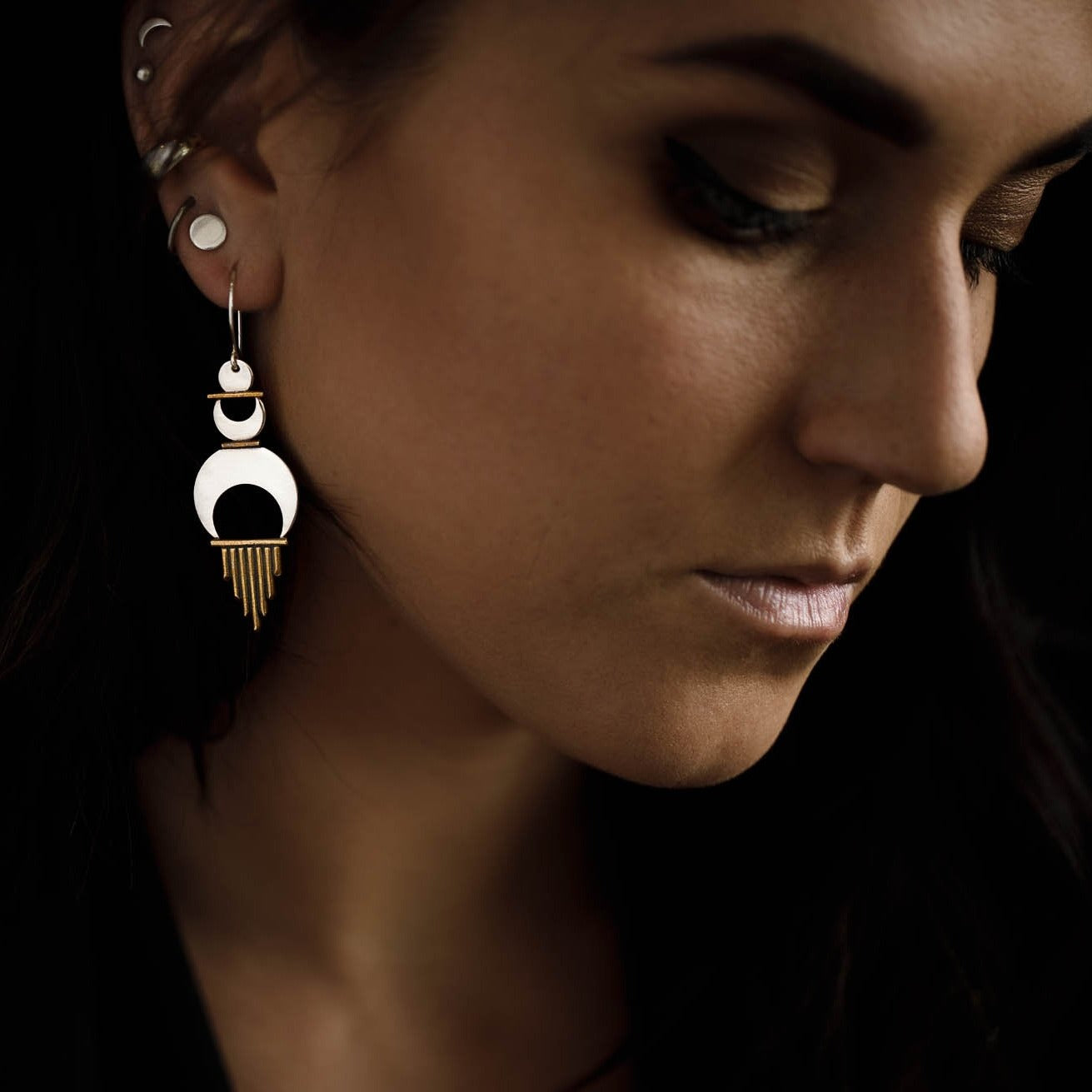 The Alchemy Earrings worn with the Shatki Studs to show how these statement earrings look with a second piercing.