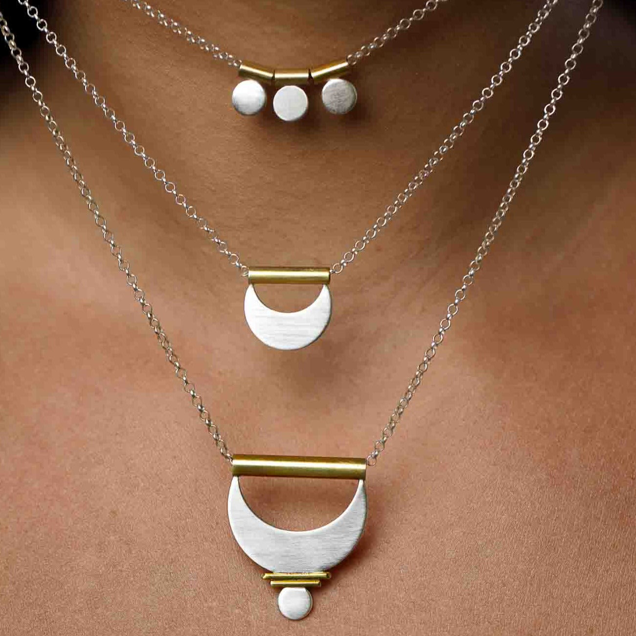 The Shatki Pedanmt layered with he Crescent Moon Pendant and the Large Prana Pendant.