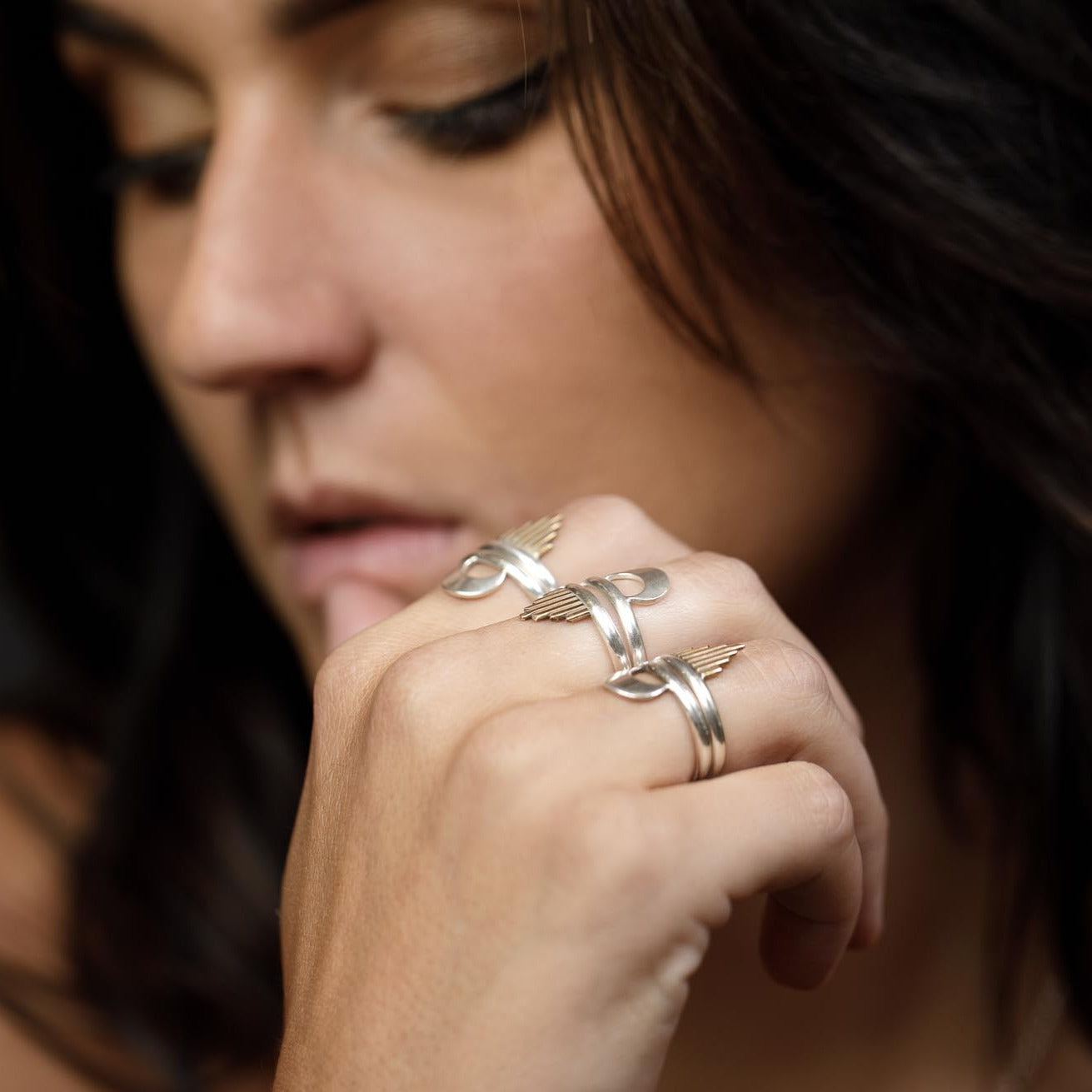 Mixed metal stacking rings with a brass sun ray on one ring and a silver crescent moon on the other.  Uniting the sun and the moon as a reminder of balancing the masculine and the feminine.