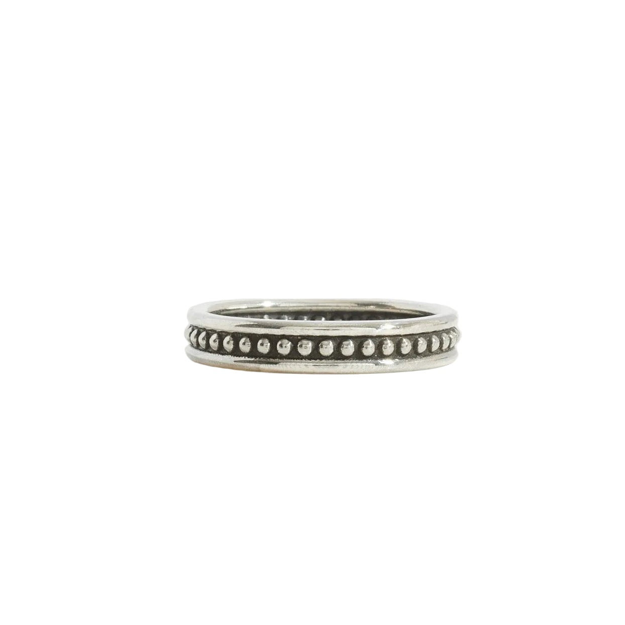 A silver band ring with a row of beaded wire, photographed on a seamless white background.