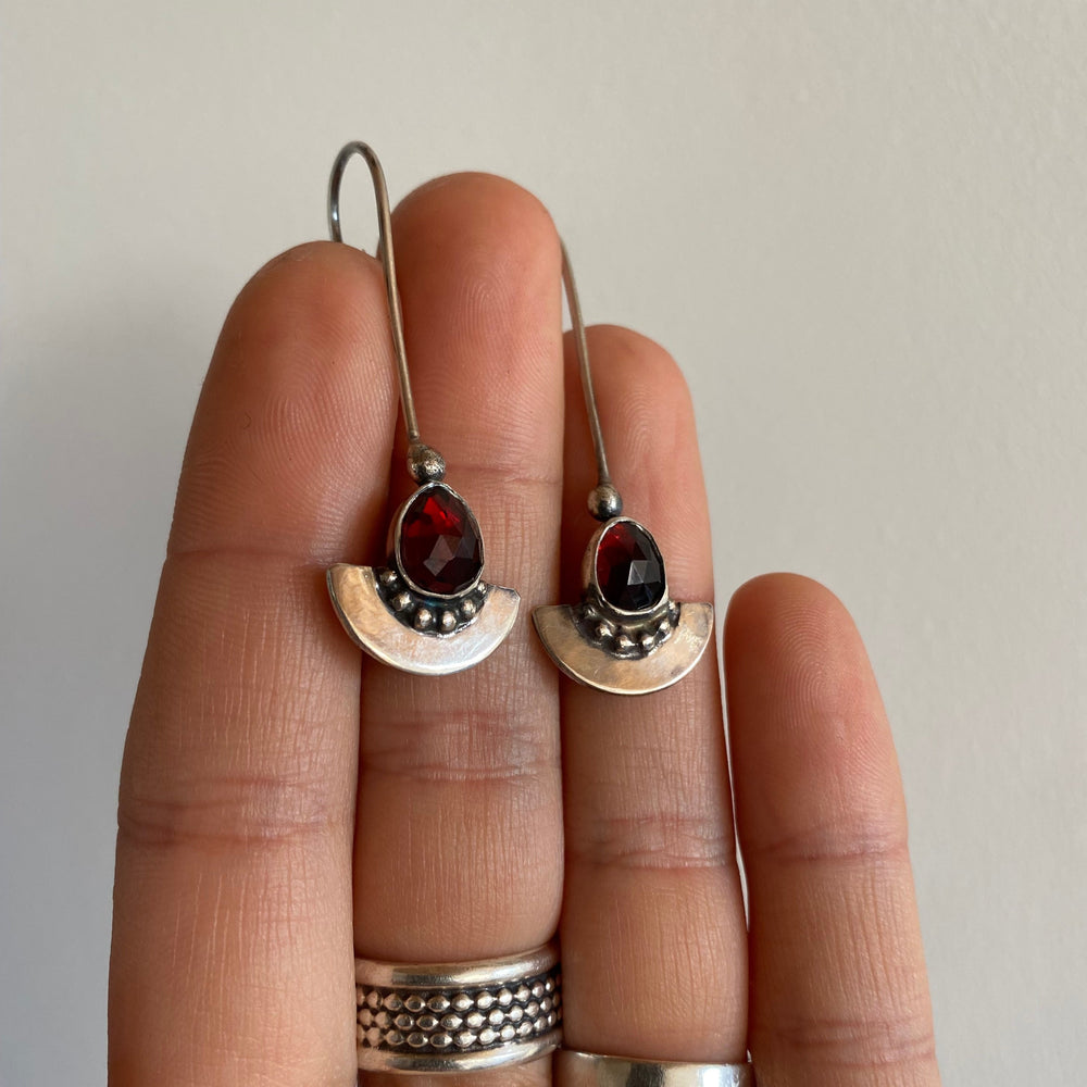 
                  
                    Garnet Shield Earrings
                  
                