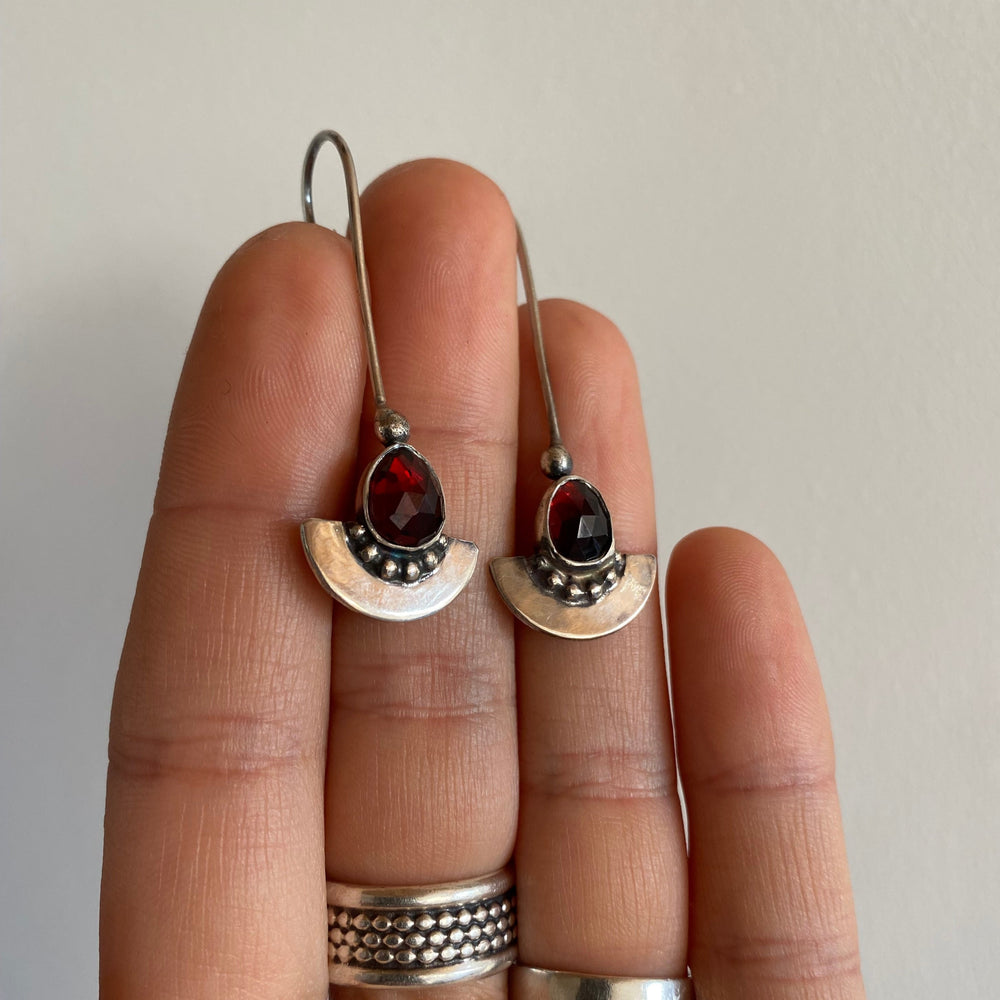 
                  
                    Garnet Shield Earrings
                  
                