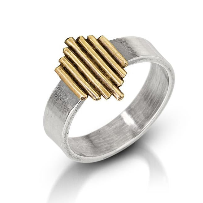 
                  
                    Silver ring band featuring a golden stylized sun ray. 
                  
                