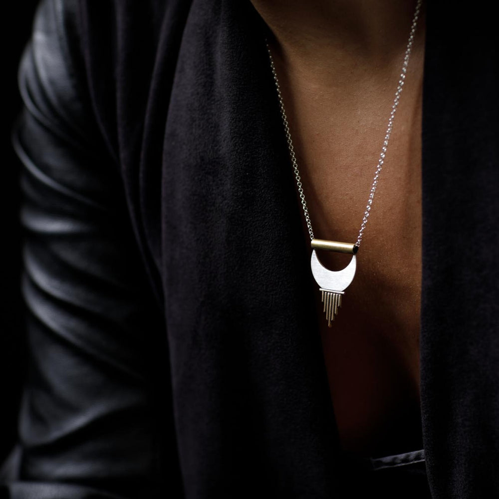 Dangling from her neck the Alchemy Pendant feels strong yet feminine. 