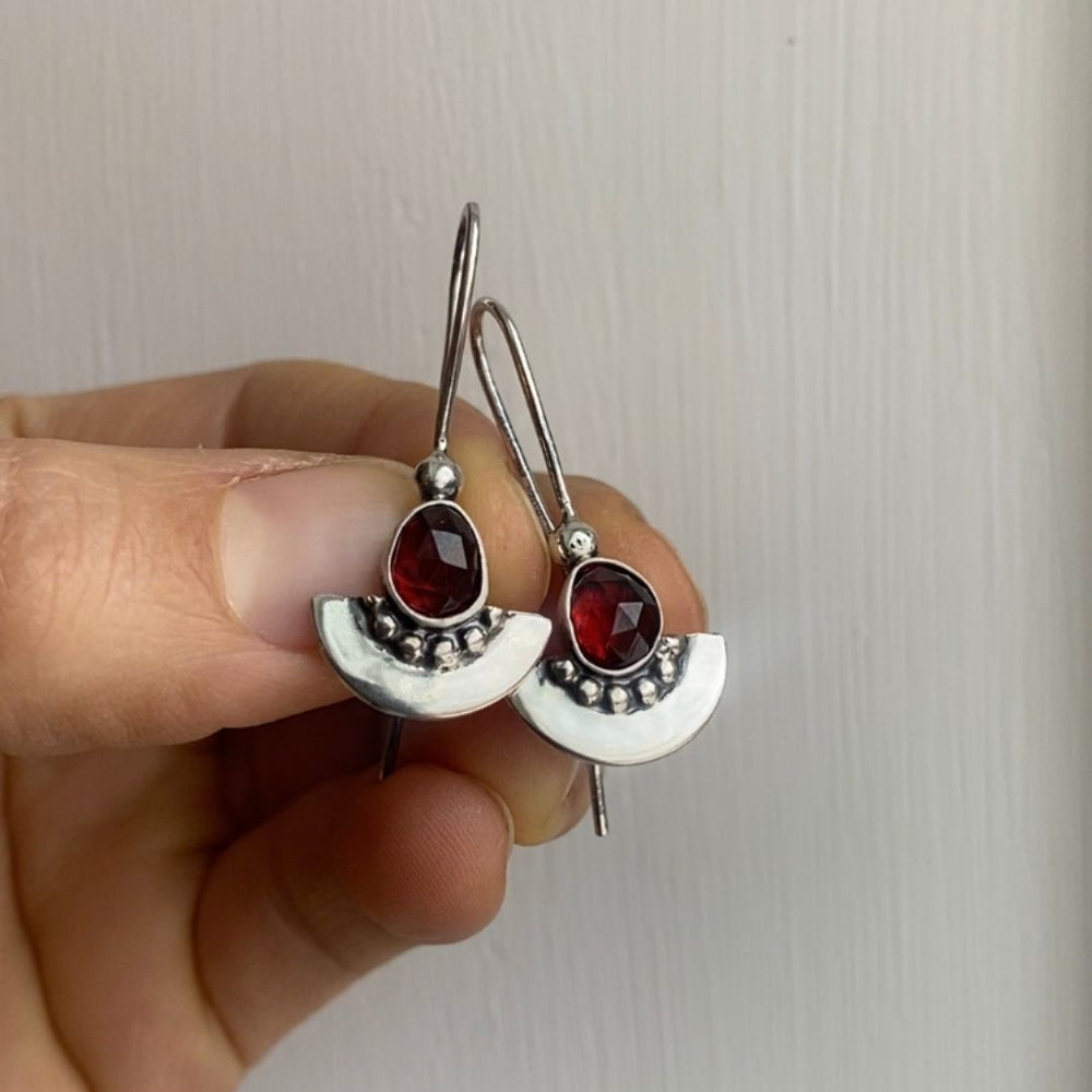 
                  
                    Garnet Shield Earrings  | Silver
                  
                