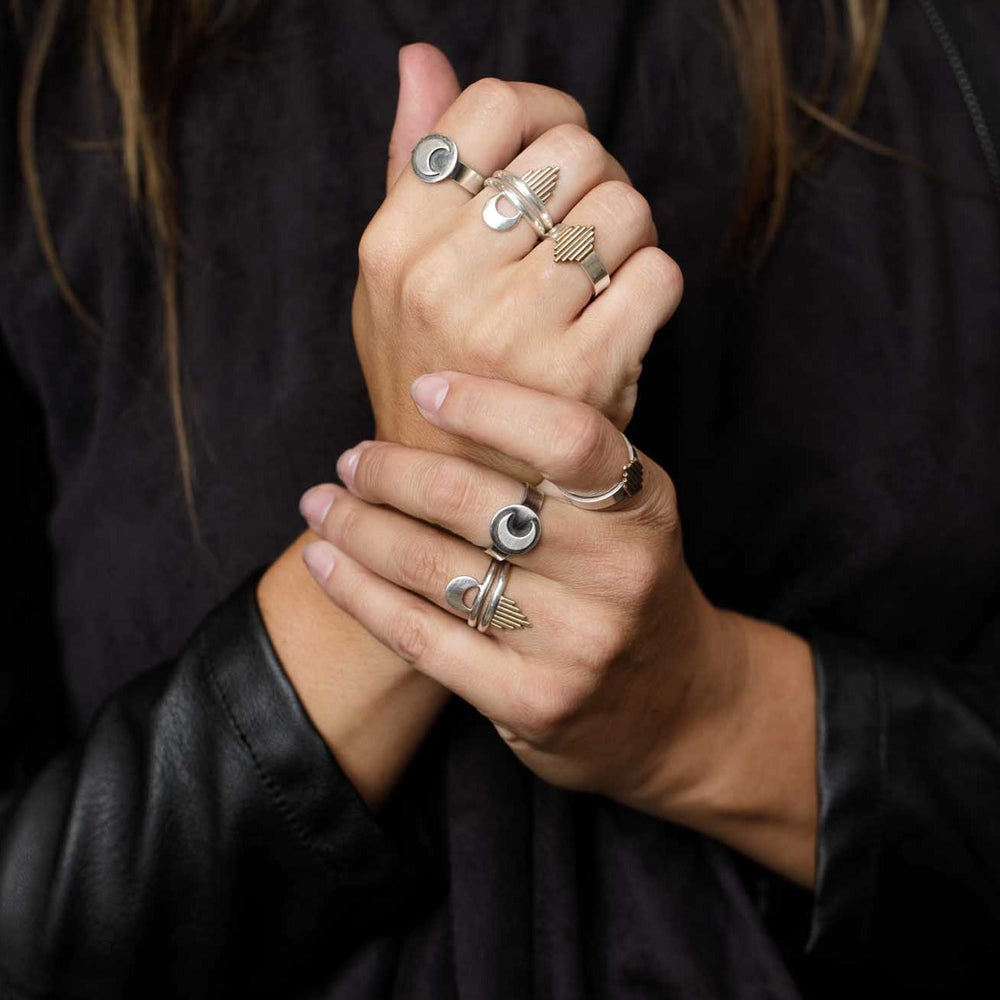 
                  
                    Fists full of mixed metal rings worn as a reminder of the energy you want to focus on channeling. 
                  
                